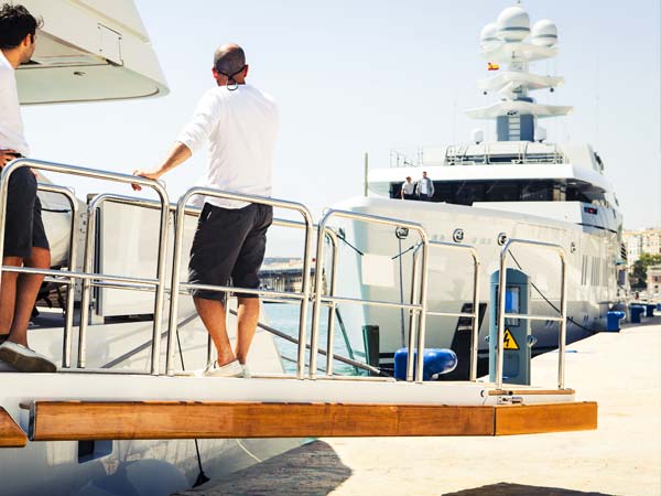 Image of seafarer on their boat at the port 