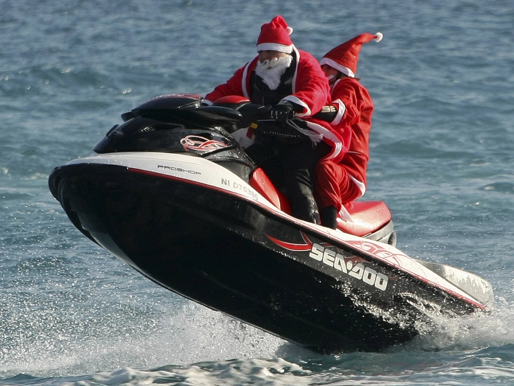 Two Santas on Jet Ski in Cote d'Azur. Photo by Lionel Cironneau / Source AP