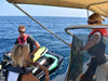 Sammi, Seascope France RYA instructor giving instructions to people while being on the tender boat at sea