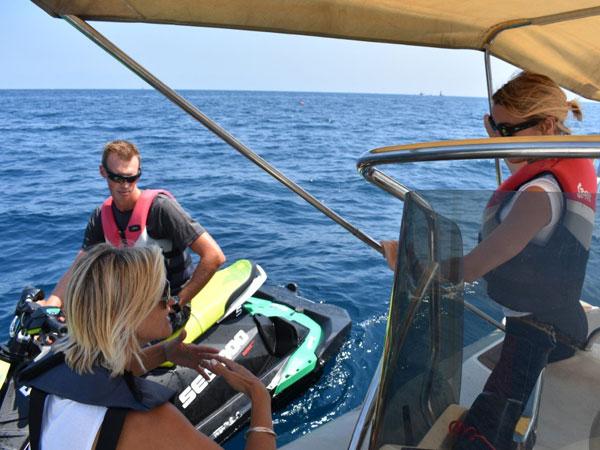 Sammi, Seascope France RYA instructor giving instructions to people while being on the tender boat at sea